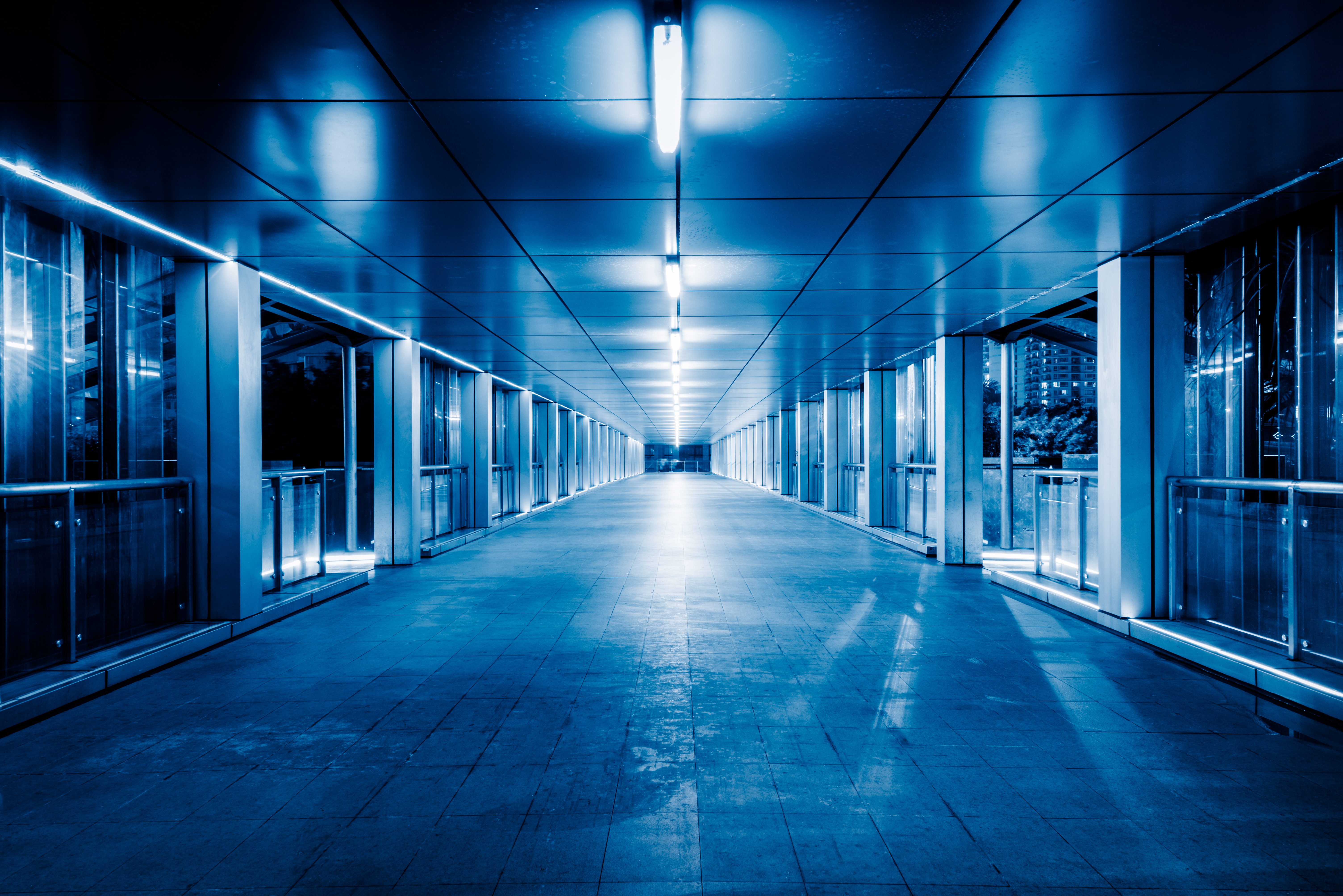 State-of-the-art data center with blue LED lighting and server racks